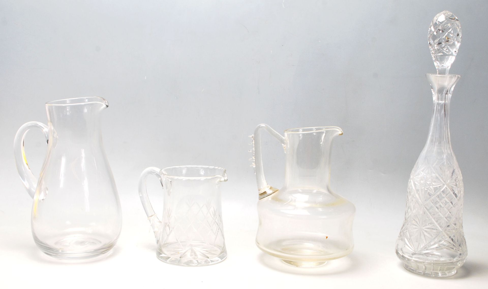 A mixed collection of glass to include retro and antique examples cut glass decanters, antique