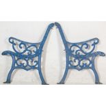 A pair of 20th Century antique  cast iron scroll work garden bench ends painted in blue.