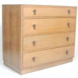 A 1930's Art Deco oak chest of drawers. Raised on an inset plinth base with an upright back of 4