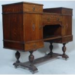 A 1930's Art Deco oak drop centre sideboard - dresser. Raised on cup and cover legs with block