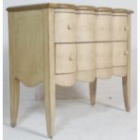 A 20th century Serpentine fronted French painted shabby chic commode chest of drawers. Raised on