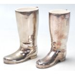 A pair of 20th Century silver plated drinks measures in the form of rising boots with raised