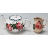 A rare early 20th century Bristol Poutney Rose pattern pottery ceramic teapot and matching creamer