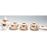 A 20th Century Royal Albert Old Country Roses tea service to include six tea cup trios, tea pot