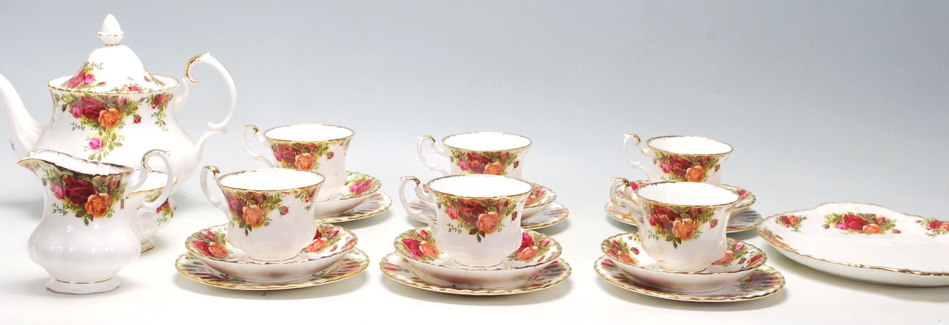 A 20th Century Royal Albert Old Country Roses tea service to include six tea cup trios, tea pot