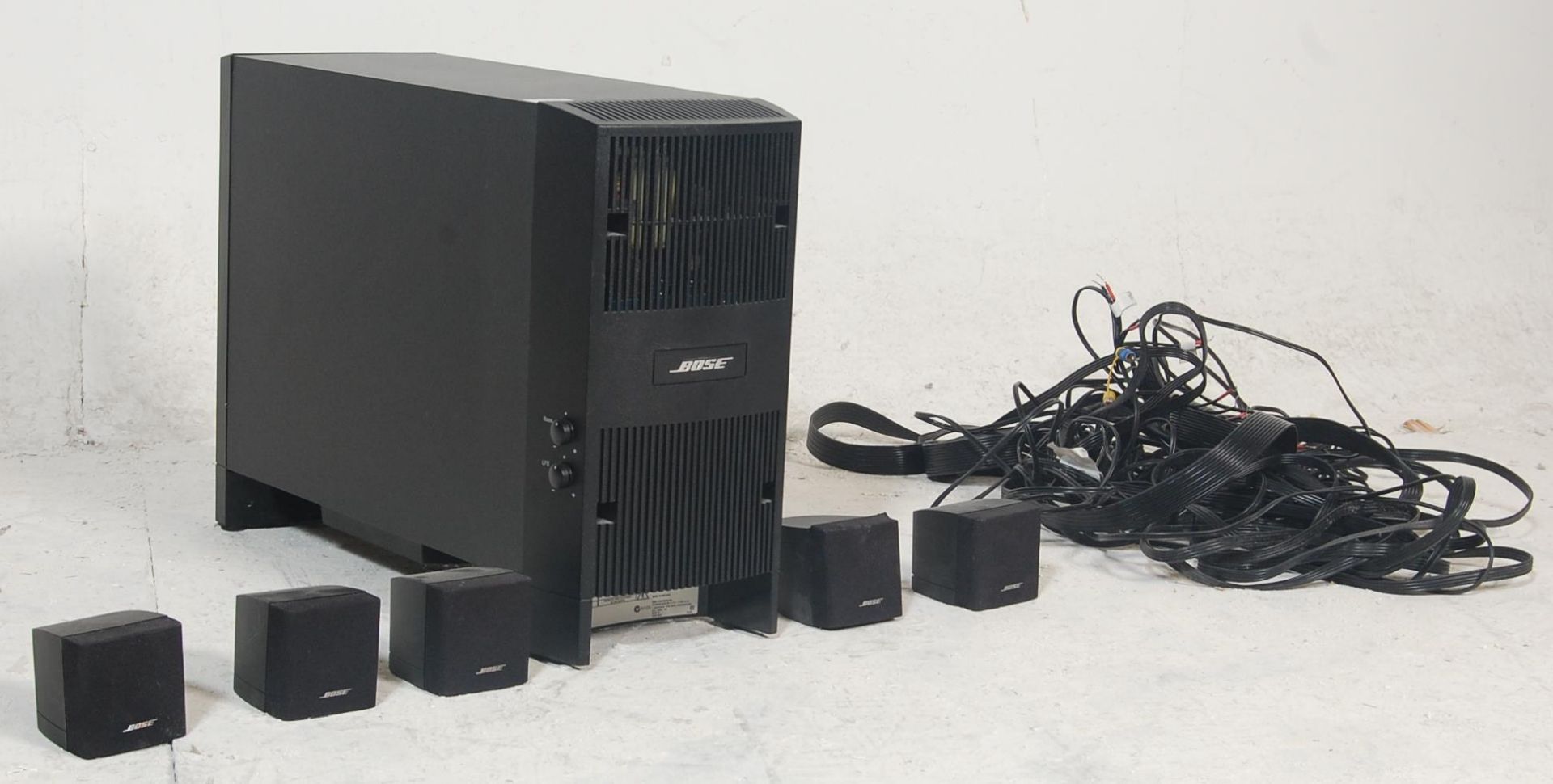 BOSE home cinema 5.1 system with sub woofer and five cube speakers. This system is powered (