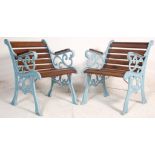 A pair of late 20th Century Victorian style garden seats having wooden slats and shaped foliate