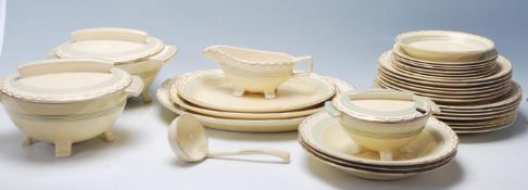 A 20th century Bristol pottery " Amberone " patten part dining service comprising of large plates,