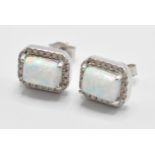 A pair of 925 silver cz and opal earrings having central opal panels with a halo of CZ stones.