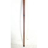 A vintage antique style wooden walking stick having a brass shaped handle which unscrews to reveal a