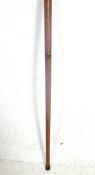 A vintage antique style wooden walking stick having a brass shaped handle which unscrews to reveal a