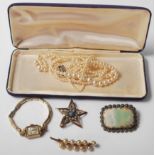 A collection of vintage costume jewellery to include a 1950's Nettie Rosenstein star design brooch