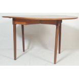 A retro vintage 1970s teak wood drop leaf dining table / Sutherland table having a shaped leaves