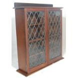 A Victorian 19th century carved oak and leaded glass library bookcase cabinet with plinth base and