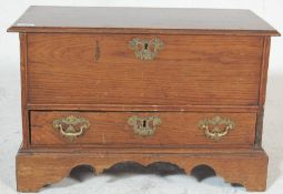 An early 20th century antique oak small proportions bed end blanket box having hinged lid over a