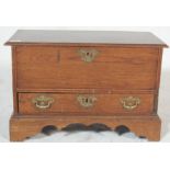 An early 20th century antique oak small proportions bed end blanket box having hinged lid over a