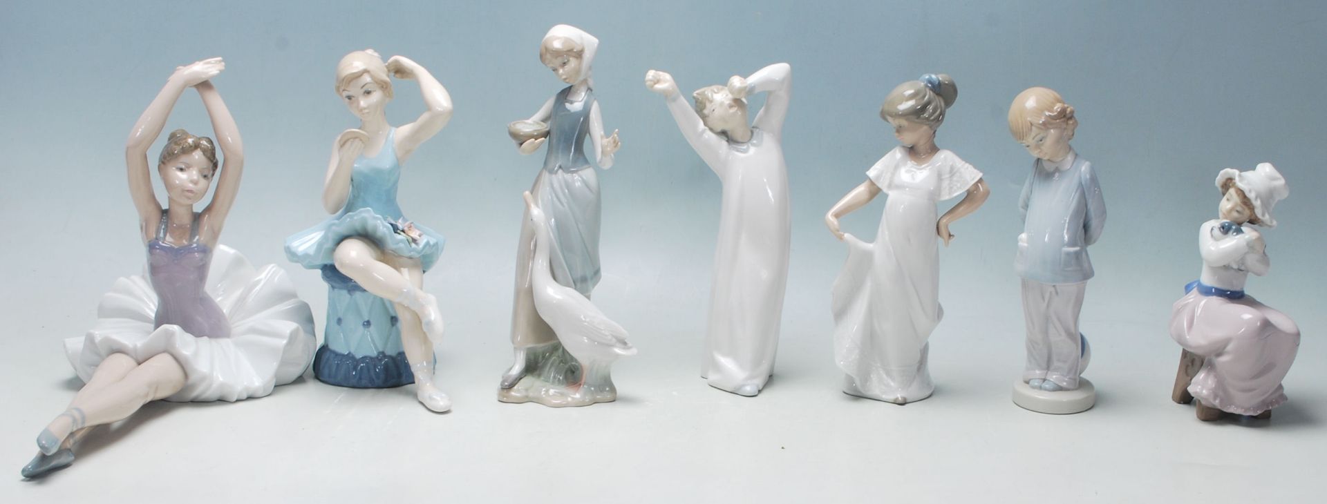 Lladro / Nao - A collection of five late 20th Century Lladro / Nao / Mediflor figurines to include a