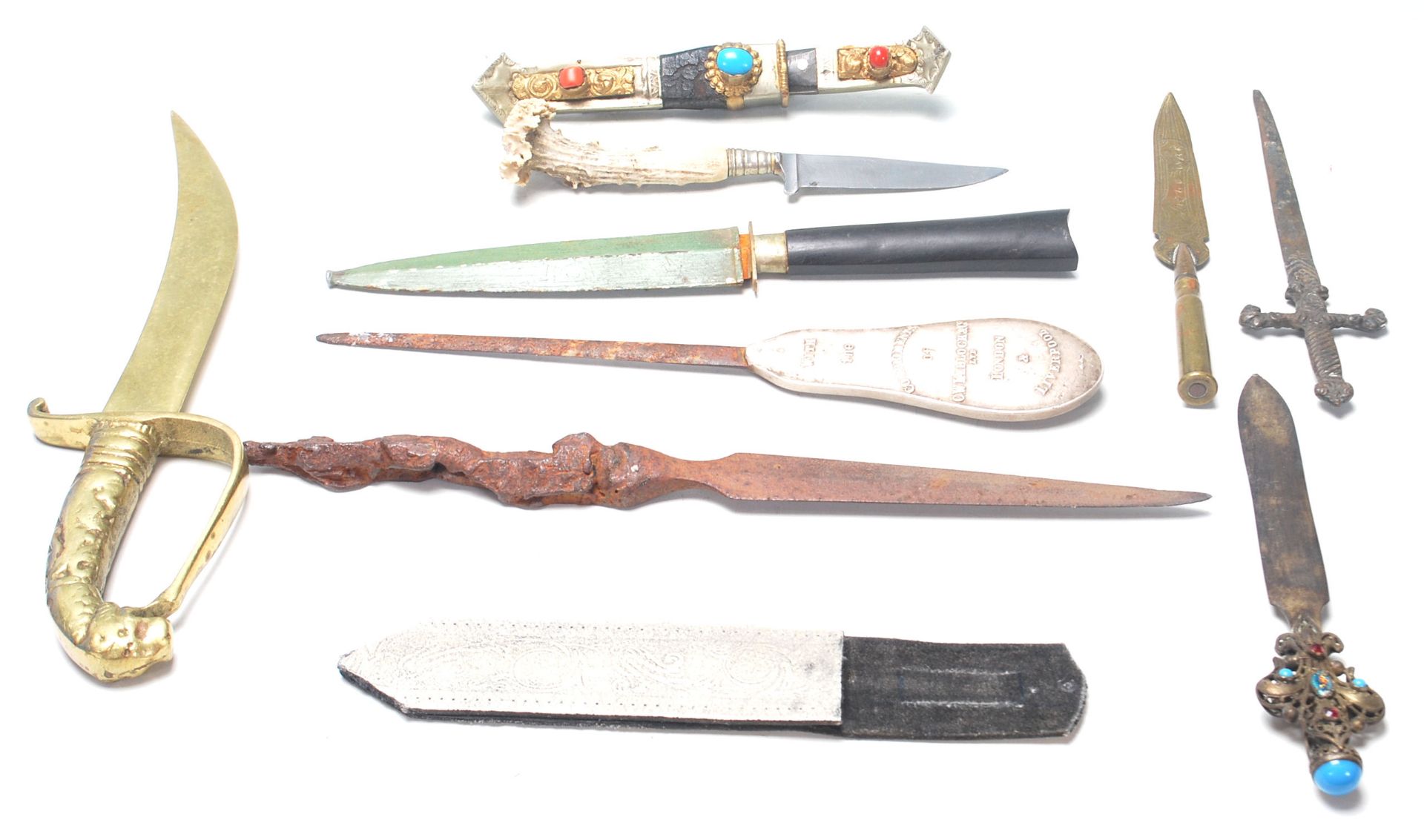 A collection of 19th Century and later weapons to include a commando knife, a Tibetan knife with