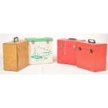 A collection of four retro vintage vinyl record carry / travel cases decorated in red, beige faux