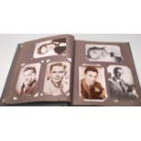 A vintage retro mid Century postcard album filled with black and white photographic postcards of