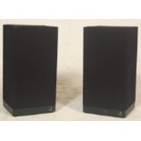 A pair of Kef Celeste III speakers type SP1107 No 16620 having  black fabric protection, raised on a