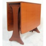 A retro 20th Century G-Plan teak drop leaf dining table having splayed foot frame, the end leaves