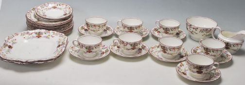 An early 20th century Aynsley fine english bone china tea service comprising of eight cup,saucers