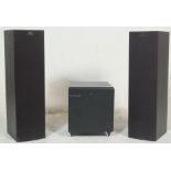 A vintage KEF PSW 1000 floor standing Subwoofer having adjustable volume buttons to the back and