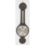 An early 20th century carved oak aneroid wall barometer. The barometer of banjo form having