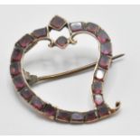 A 18th/ 19th Century Georgian witches heart brooch being set throughout with square cut garnets with