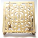 A Victorian 19th century pierced brass table top reading stand lecturn. The pierced brass upright of
