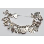 A good silver 925 charm bracelet adorned with multiple charms to include temple, globe, heart