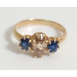 A 19th Century Victorian ladies 18ct gold ring being set with an oval cut brown diamond flanked by
