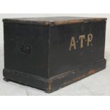 A early 20th century antique black painted shipping box / blanket box having hinged lid revealing
