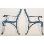 A pair of 20th Century antique  cast iron scroll work garden bench ends painted in blue.