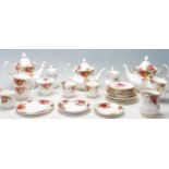 A group of 20th Century Royal Albert Old Country Roses pattern tea service to include three teapots,