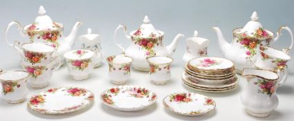 A group of 20th Century Royal Albert Old Country Roses pattern tea service to include three teapots,