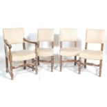 A set of 4 1930's oak panel back Cromwellian style dining chairs. Raised on block and turned legs
