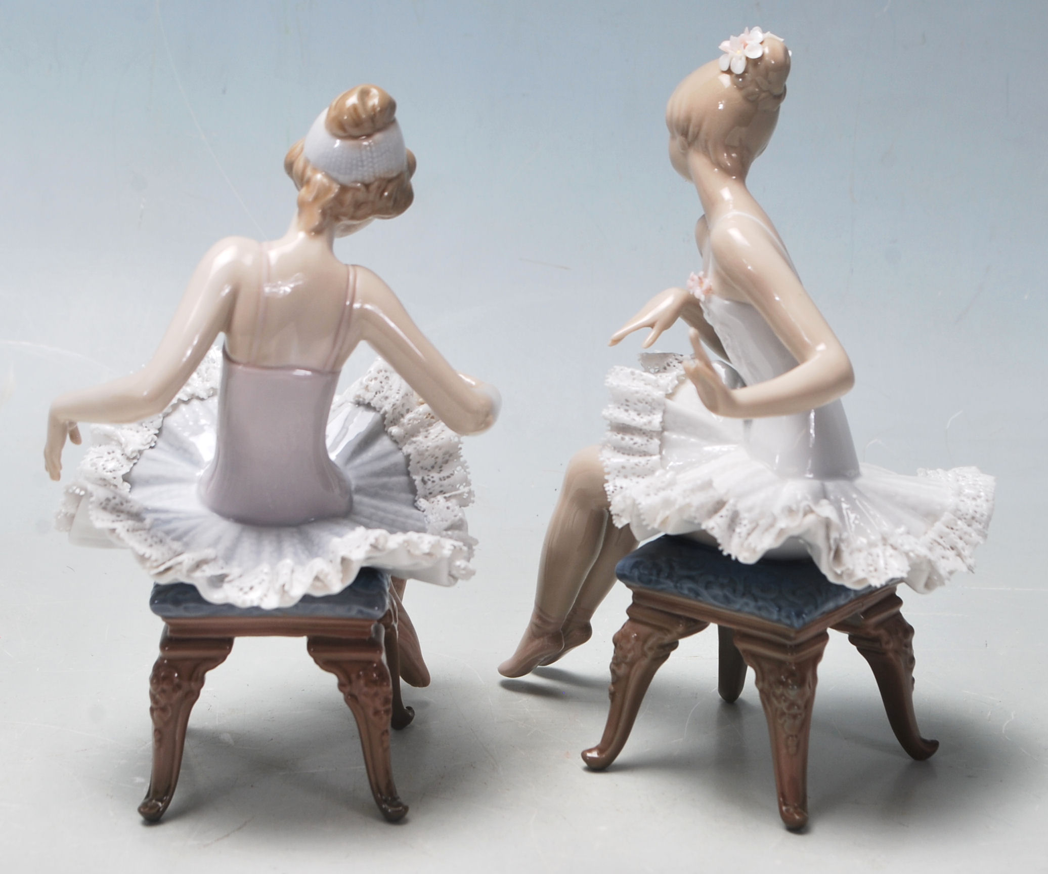 LLadro - A pair of late 20th Century vintage ceramic ballerinas comprising two seated girls getting - Image 3 of 6