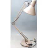 A vintage 20th Century Herbert Terry style Industrial anglepoise desk lamp in a beige colourway,