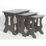 A contemporary 20th century Ercol Furniture beech and elm wood nest of tables in the Chaucer range /