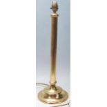 A 20th Century tall brass Corinthian column table lamp having a reeded column raised on a round