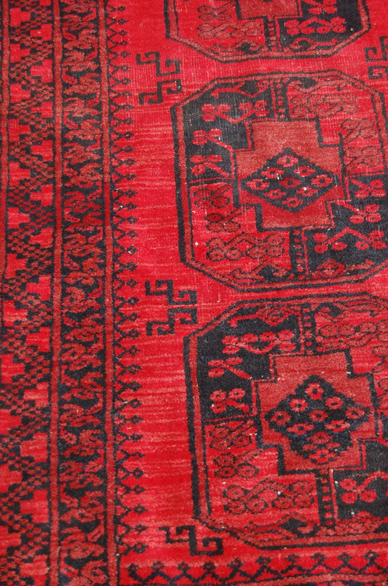 A pair of Islamic / Persian carpet rugs comprising of a red and black carpet having three - Image 3 of 9