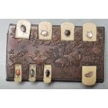 A 19th century Japanese bronze and ivory game / score counter having hinged ivory tokens with mother