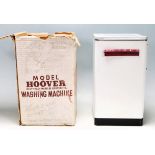 A retro vintage 1960s Model Hoover Washing Machine toy by Mettoy having a mini wringer set within