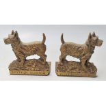 A pair of early 20th Century brass bookends in the shape of a Scottish Terrier. The bookends have