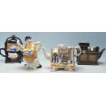 A collection of four Paul Cardew Designs novelty ceramic teapots comprising a twin pedestal desk,