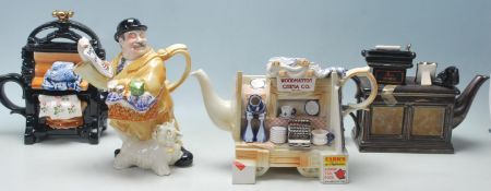 A collection of four Paul Cardew Designs novelty ceramic teapots comprising a twin pedestal desk,