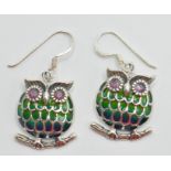 A pair of silver 925 plique a jour earrings in a form of a owl sitting on a branch with red stone