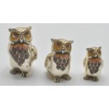 A graduated set of three in a manner of Saturno silver and enamel figures of owls. The owls have
